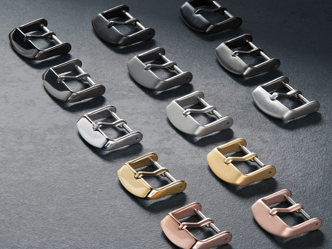Assortment of watch buckles in silver, gunmetal, black, gold, and rose gold finishes